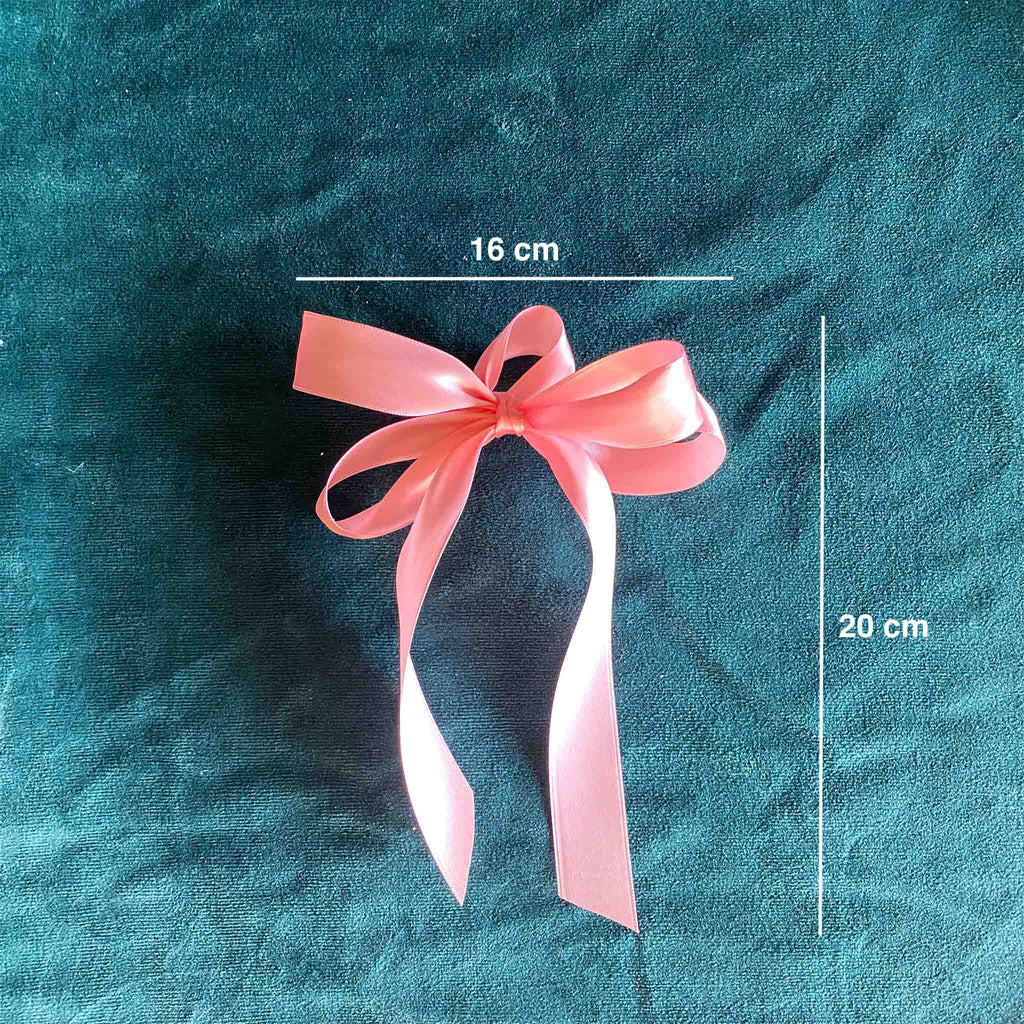 Pink Petit satin bow, hand-tied with four loops, shown with dimensions in centimetres